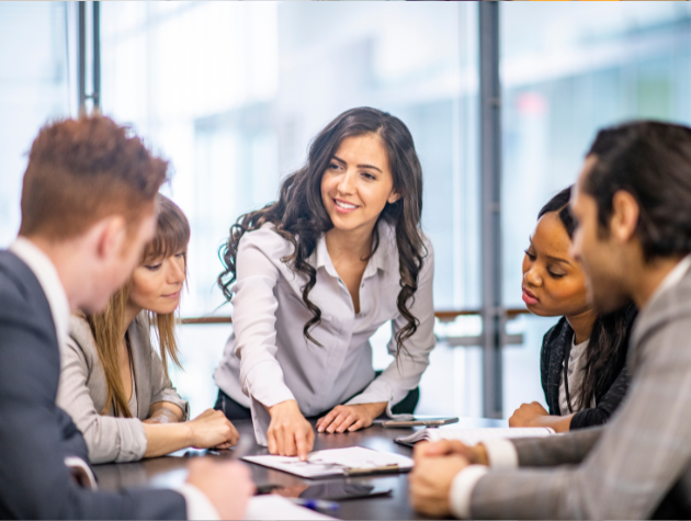 General Counsel Transitioning from Litigation to In-House at a Tech Startup A female general counsel in a modern office environment collaborating with a startup product team, symbolizing the transition from litigation to strategic in-house legal leadership.