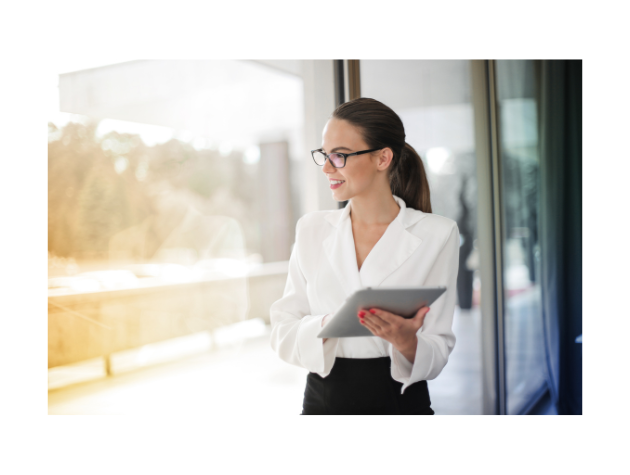 A confident lawyer looking thoughtfully out a window, symbolizing career exploration and future possibilities.