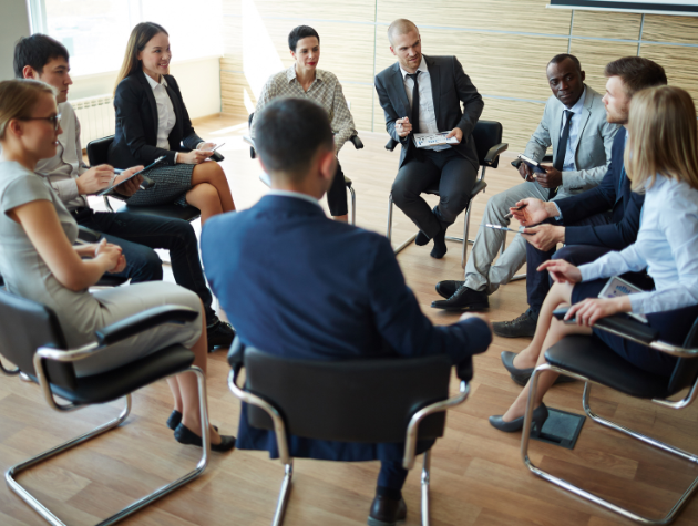 In-house lawyer listening in on a sales team meeting, bridging legal advice with business strategy.