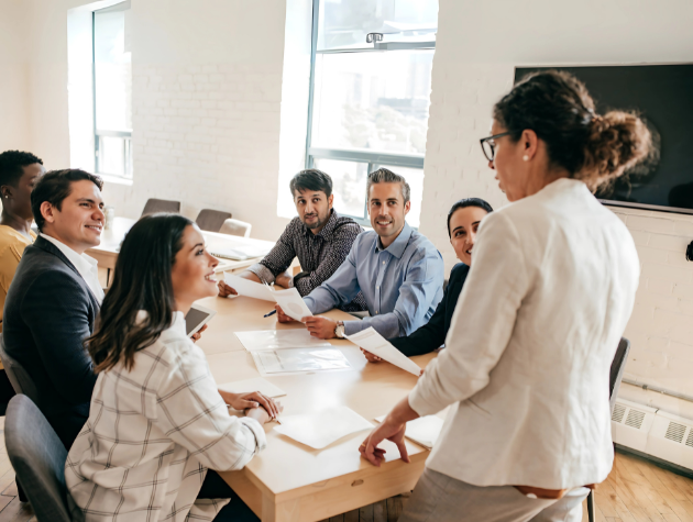 Confident Native American female lawyer leading a team meeting in a law firm, representing leadership skills for legal professionals.