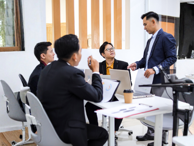In-house lawyers collaborating in a modern office while discussing legal issues related to new technology
