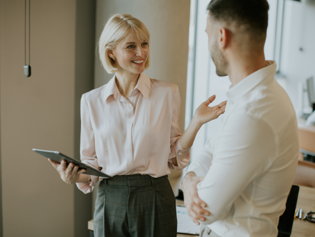 In-house lawyer discussing career growth and strategy with a business colleague