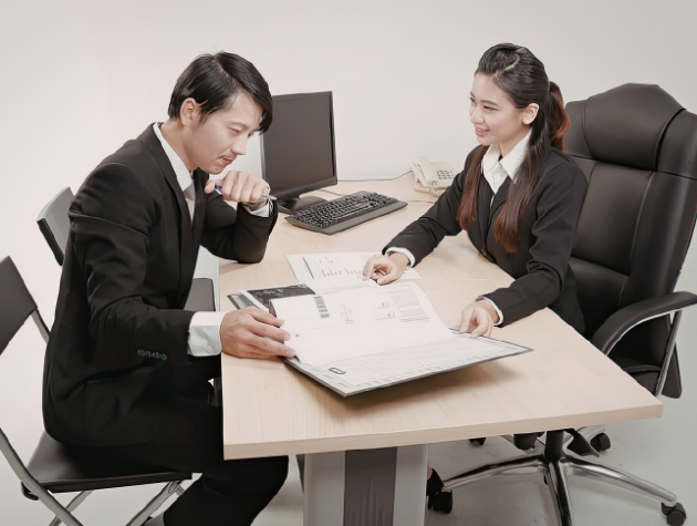 In-house lawyers reviewing documents and discussing legal technology in a corporate office